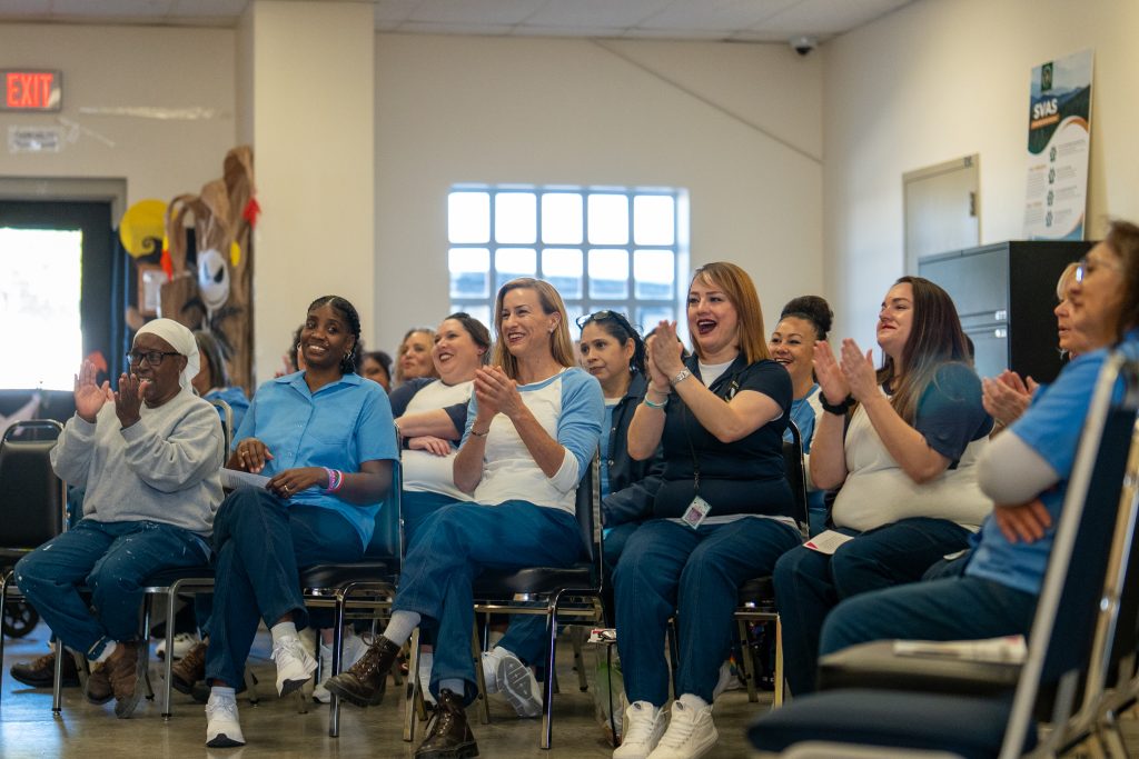 Applause from those attending the peer literacy mentor graduation.