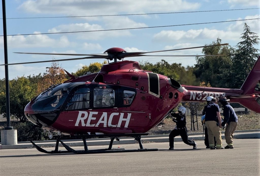 Practicing loading a patient on the REACH air ambulance at CHCF in Stockton.
