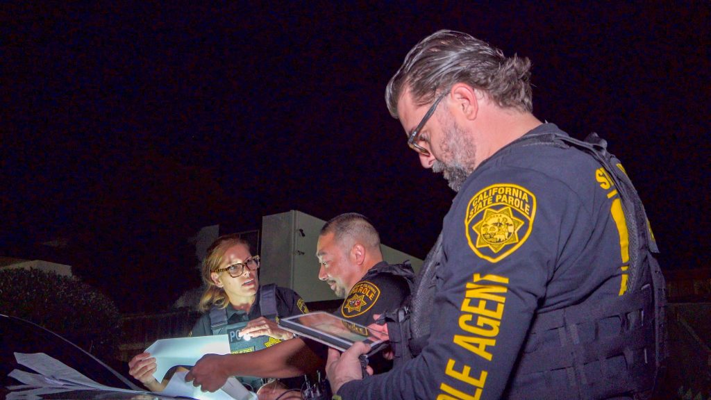 Parole agents gathering and talking