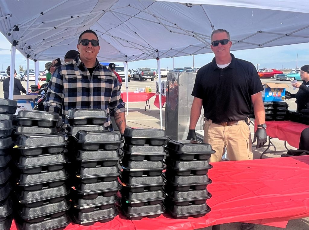 Serving food during the 20-year anniversary celebration at Kern Valley State Prison in Delano, Calif.