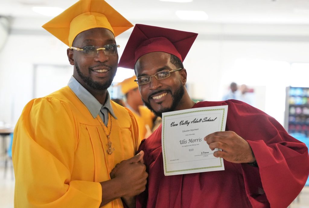 Two graduates celebrate at CSP-Solano.