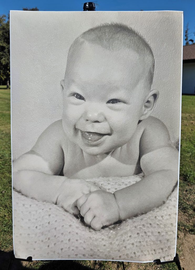 Photograph of infant Stephen Tennell displayed at the park for his service.