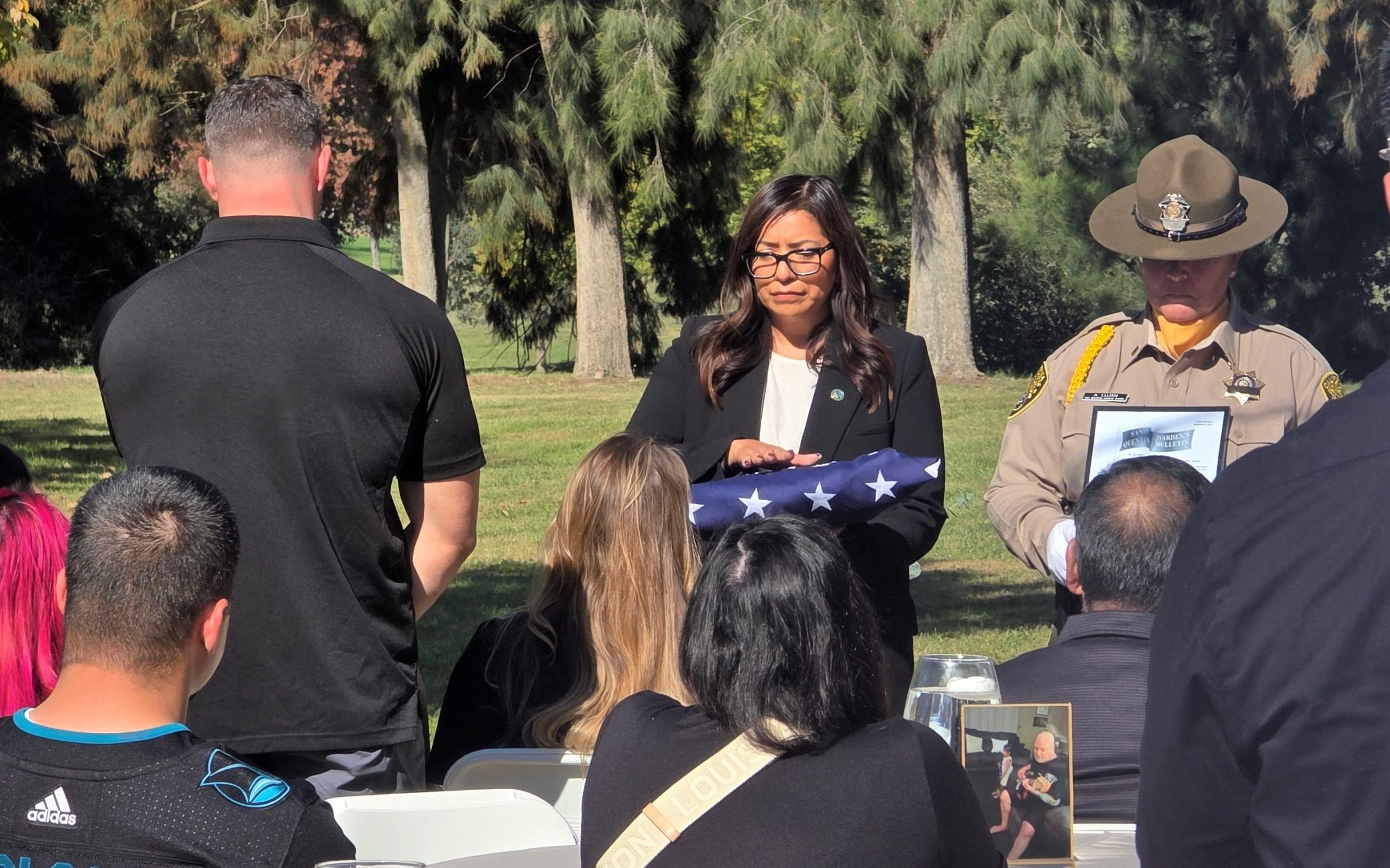 Honor Guard from San Quentin and a prison official at a service for Stephen Tennell, a retired sergeant.