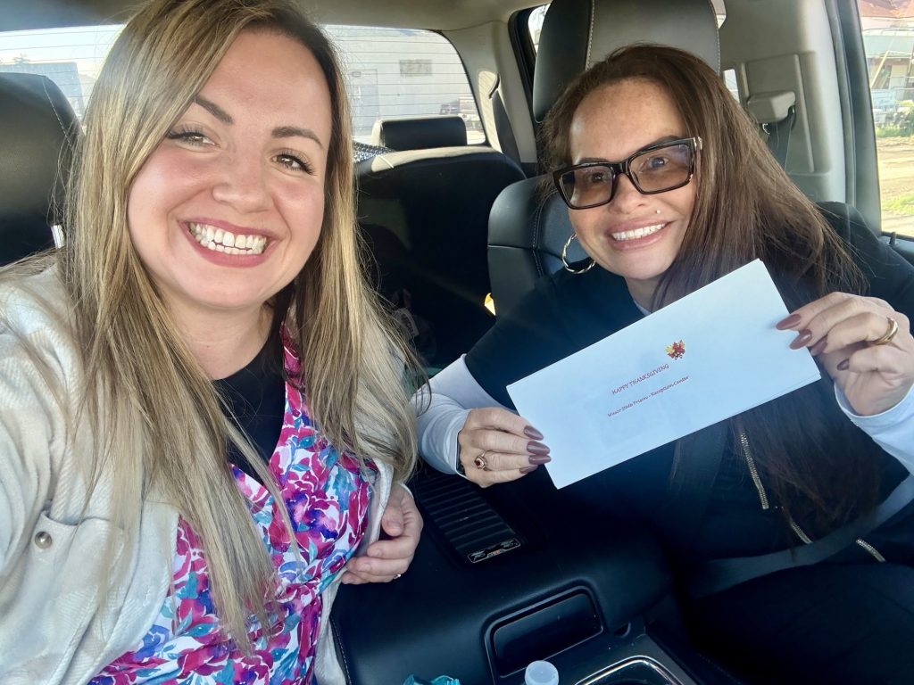 WSP-RC staff with a certificate for a turkey they will present to someone in the community.