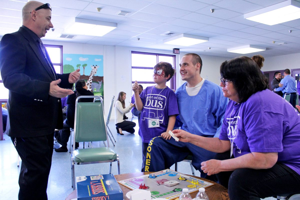 Crowe speaking to incarcerated individual and family