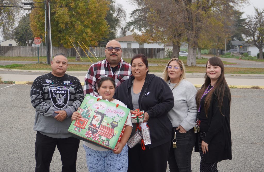 CIM staff with a family.