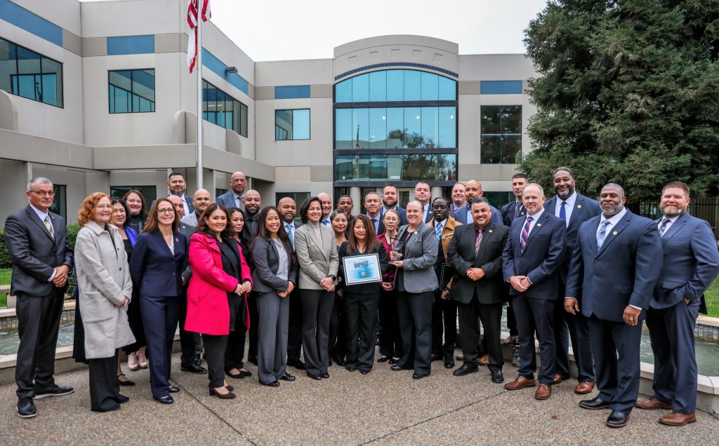 Group Impact Award honorees with executives. 