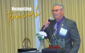 Associate Director Bryan Phillips received a health care medical liaison award, presented during an October conference.