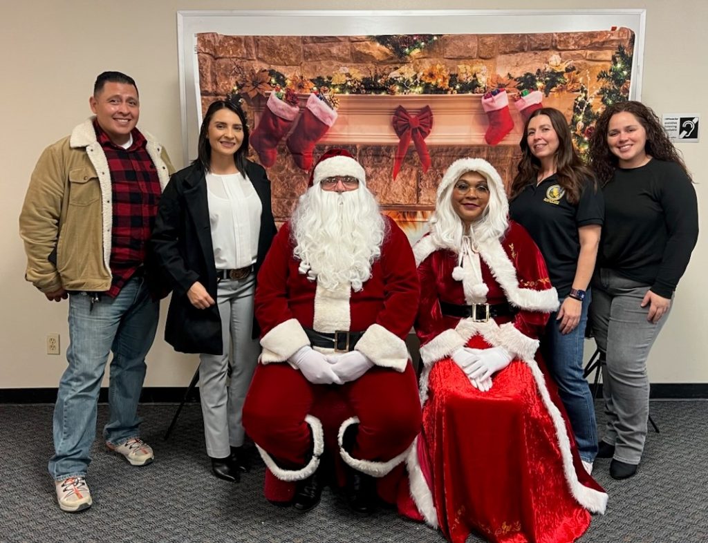DAPO Southern Region parole agents with Santa and Mrs. Claus.