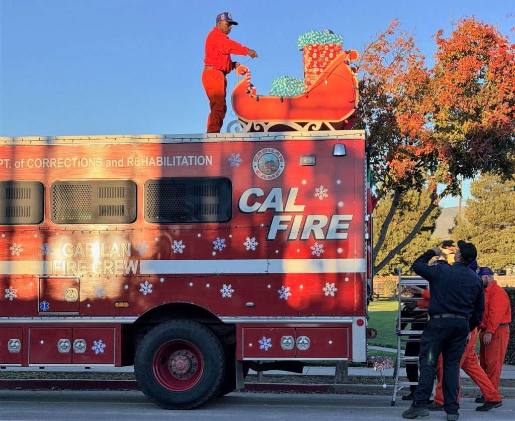 Decorating the Gabilan Conservation Camp vehicle for the Soledad holiday Christmas parade.