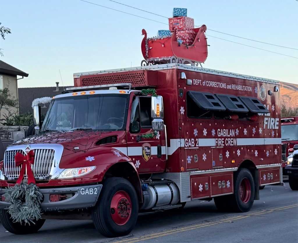 Gabilan Conservation Camp vehicle in the Christmas parade with decorations. 