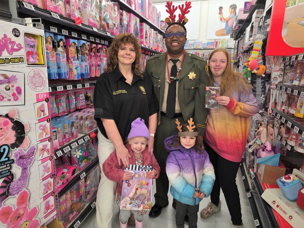 High Desert State Prison staff take children shopping during Holiday with a Hero.
