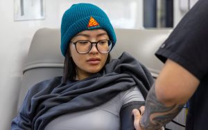 A staff member from CDCR and CCHCS headquarters donates blood during the Vitalant blood drive in Elk Grove.