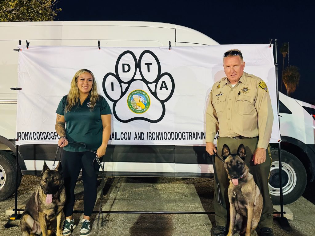 Ironwood Dog Training Academy at Ironwood State Prison with two dogs at National Night Out community event in Blythe, California.