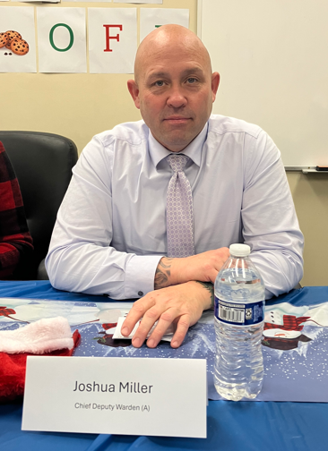 Joshua Miller, chief deputy warden at CSP-Los Angeles County was one of the judges for the staff holiday bake-off.