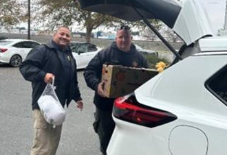 North Kern State Prison staff and Delano Police Department ready to distribute food to families in need.
