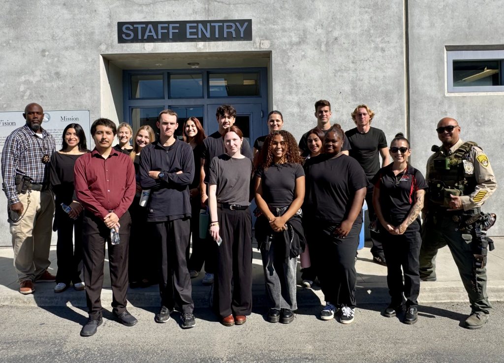 College students tour a prison in California.