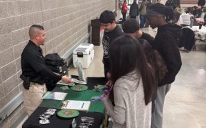 A CDCR sergeant attends an Army holiday event at the Okinawa Armory in Sacramento.