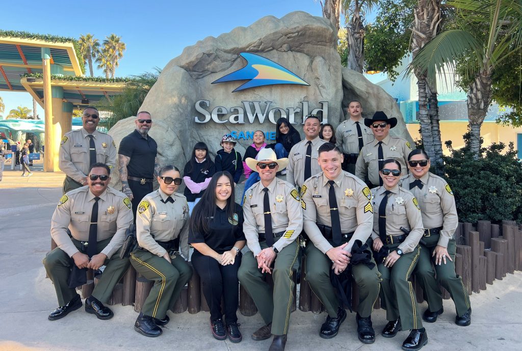 Volunteer staff from RJ Donovan Correctional Facility at Sea World in San Diego for Shop with a Cop.