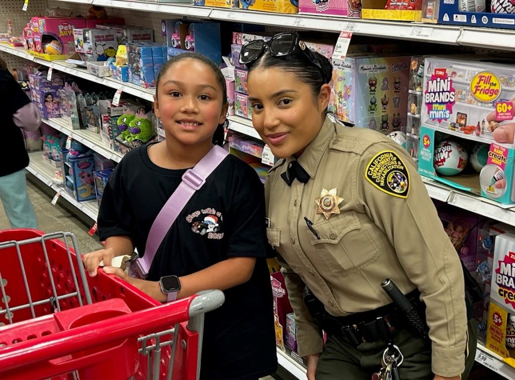 RJD Correctional officer shopping with a child.