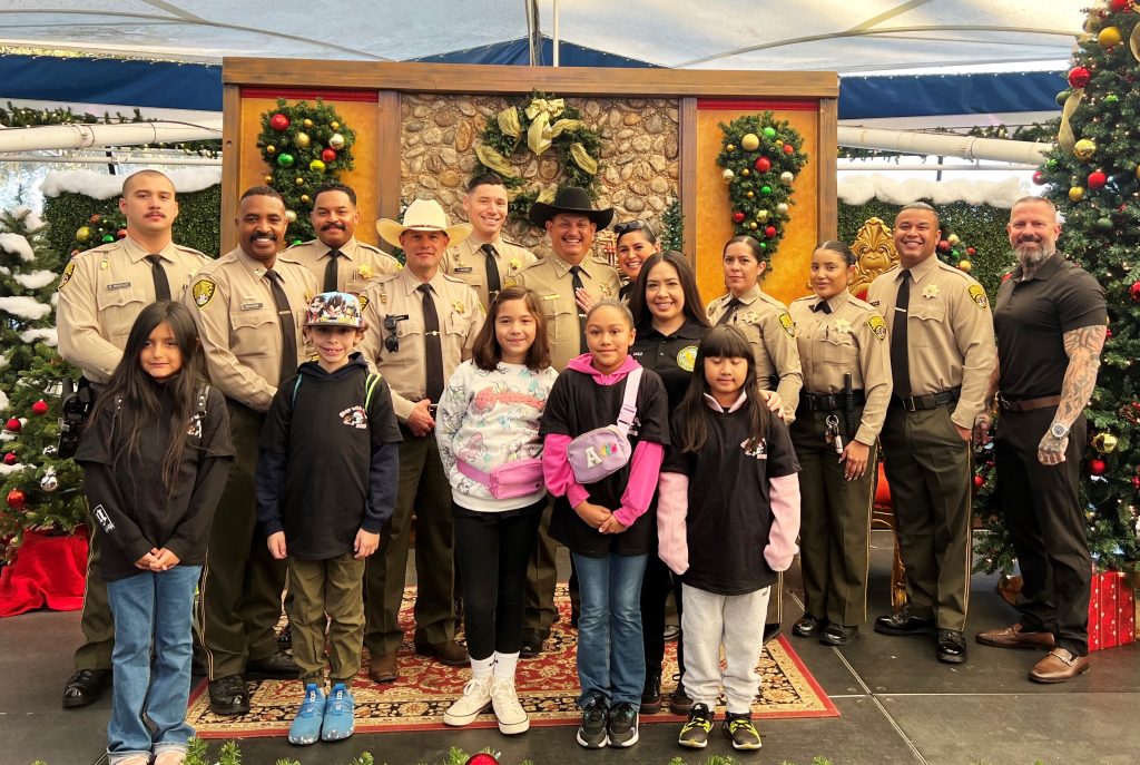 Group photo of law enforcement officers and others for RJ Donovan Correctional Facility during Shop with a Cop.