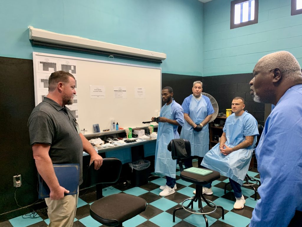 Mike Jacobellis speaking to incarcerated barbers
