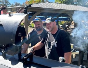 SCC staff and a CALFIRE employee work the barbecue.