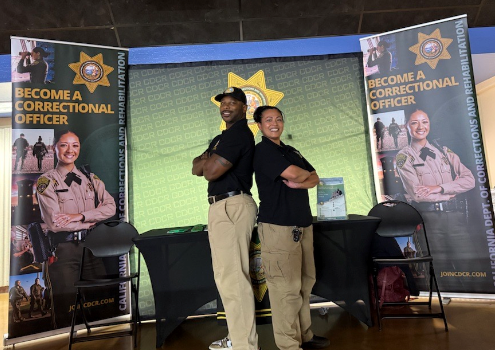 Recruiters posing back to back at SJSU