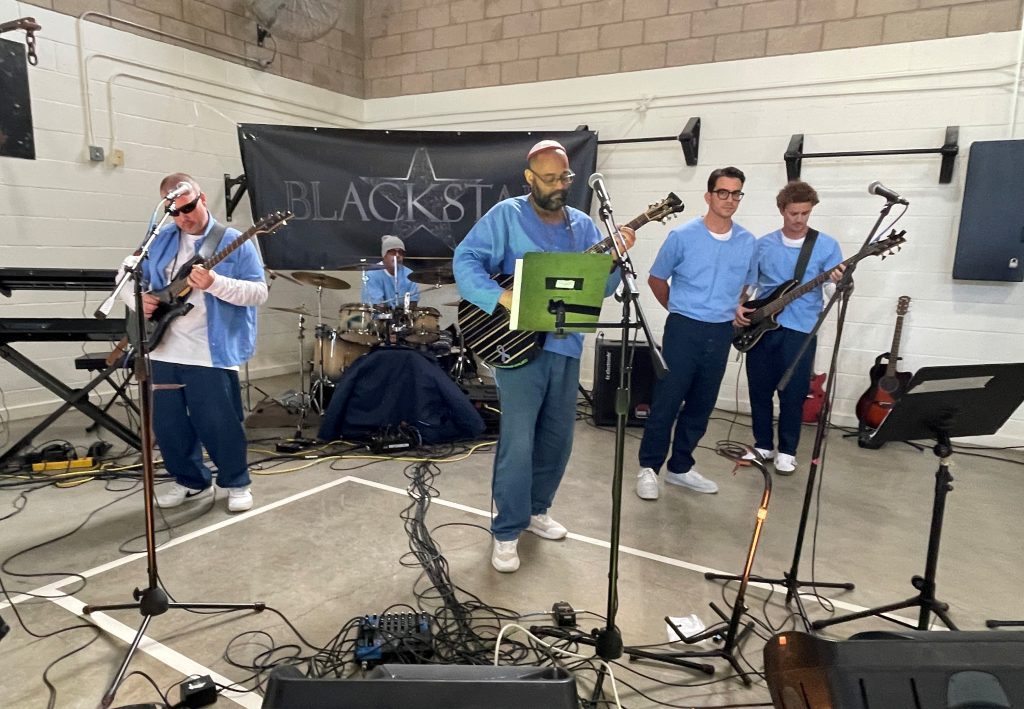 Blackstar, a band of incarcerated musicians at Valley State Prison, performed their original song, "Phoenix," during the graduation.
