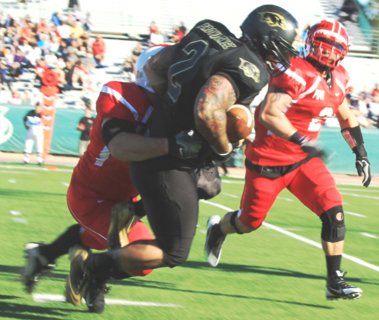 Officer Providence makes a run during a previous Pig Bowl charity game.