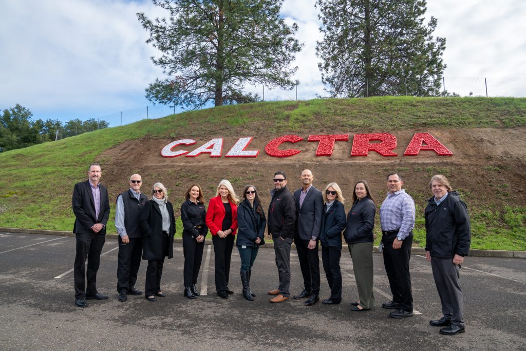 CALCTRA new name from CALPIA with staff standing in front of the hill.