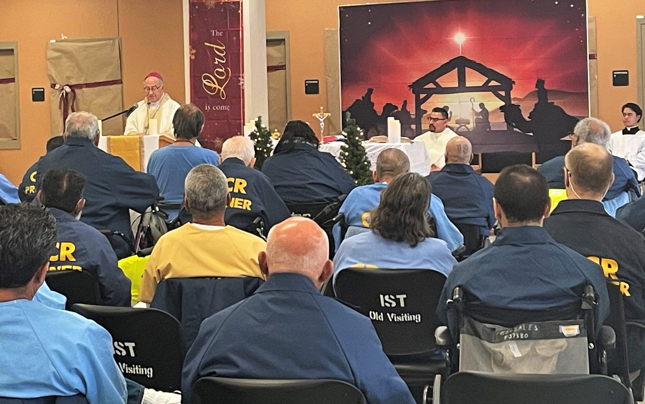 Bishop and priests visit CHCF in Stockton to hold Christmas mass for the population as well as some staff.