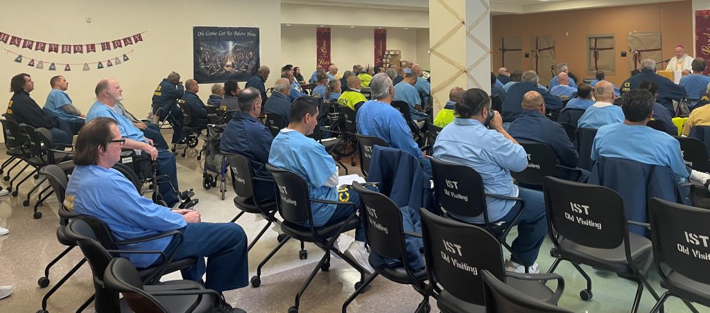 Incarcerated people attend a Catholic mass at CHCF in Stockton.