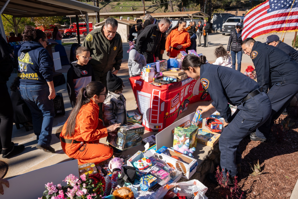 Staff and incarcerated mothers help children select toys at Malibu Conservation Camp, Jan. 15, 2026. 