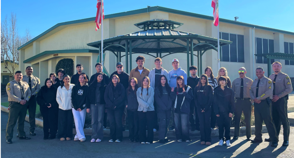 PHS students posing with academy staff for photo