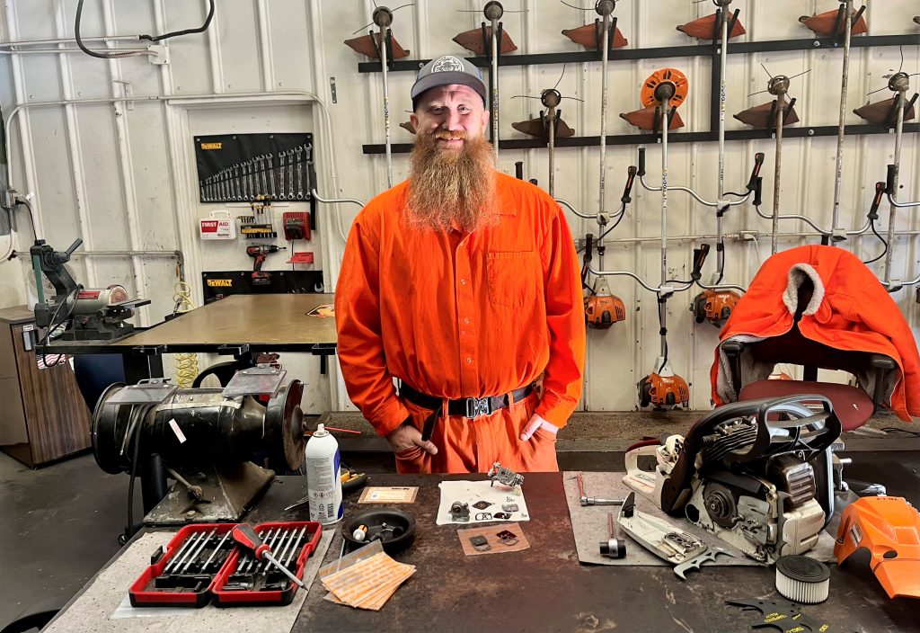 Scott DavidsonPorter, an incarcerated maintenance support crew worker, repairs chainsaws at Vallecito Conservation Camp. 