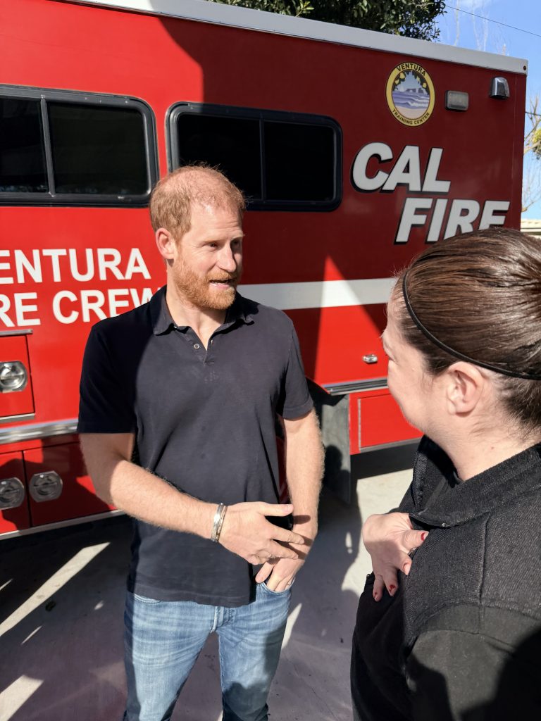 Prince Harry speaking with Parole Agent II Garcia
