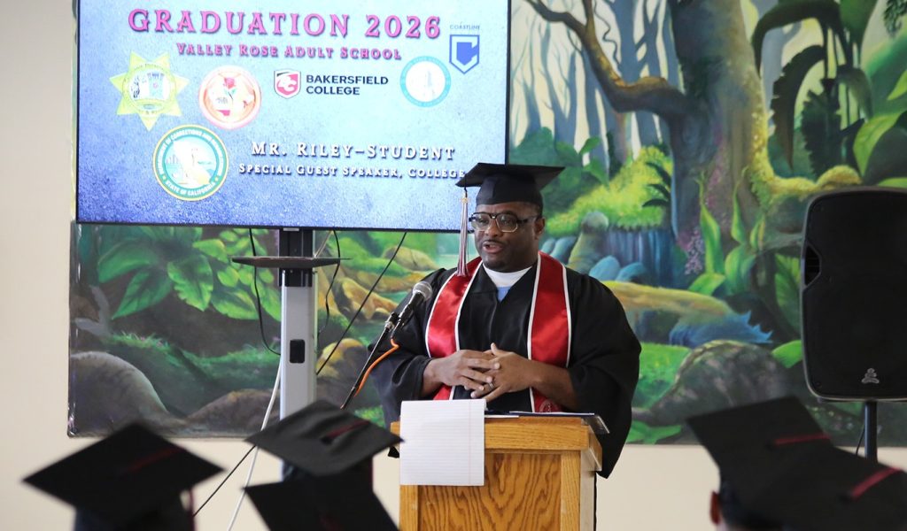 Education graduation ceremony with an incarcerated student speaking at WSP-RC.