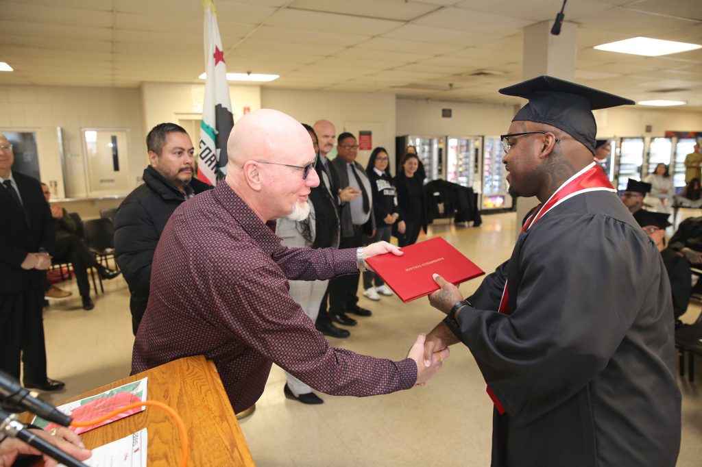 Education staff distribute diplomas and degrees at WSP-RC. 