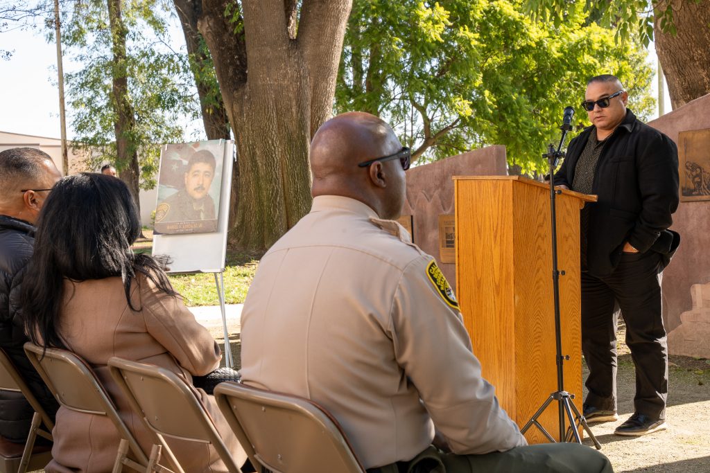 Brandon Castorena, chief deputy warden at California Institution for Men in Chino, speaks to staff and guests during the annual remembrance memorial. 