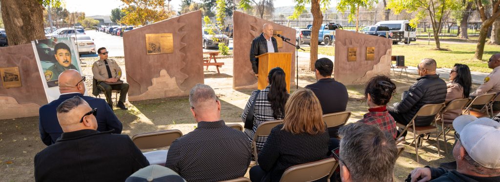 CIM doctor Victor Jordan speaks to the gathering at the memorial garden.