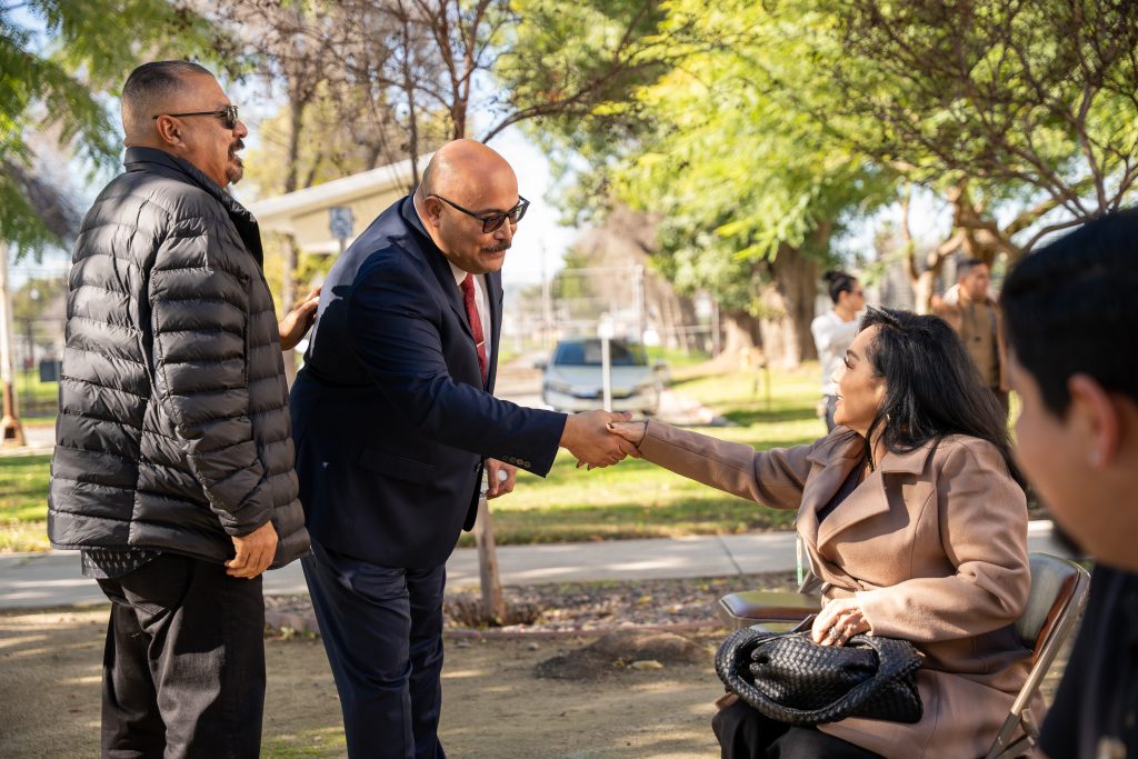 Warden at CIM speaks with the family of Officer Manny Gonzalez who was killed in the line of duty Jan. 10, 2005.