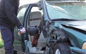Person demonstrates a hydraulic ram tool at CMF.