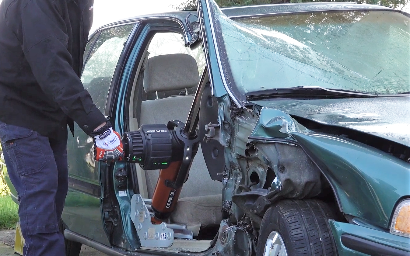 Person demonstrates a hydraulic ram tool at CMF.