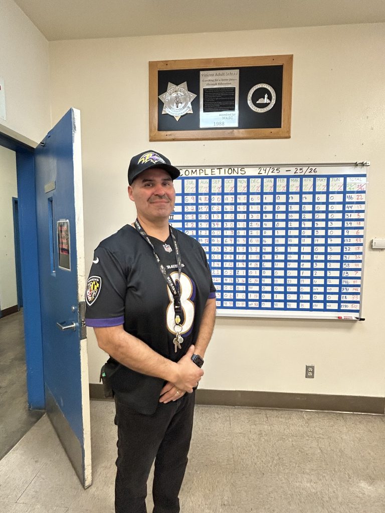 COR staff member wearing NFL gear