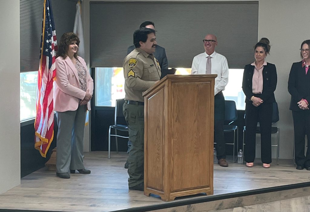 Promoted staff member on a stage at High Desert State Prison in Susanville, Calif.