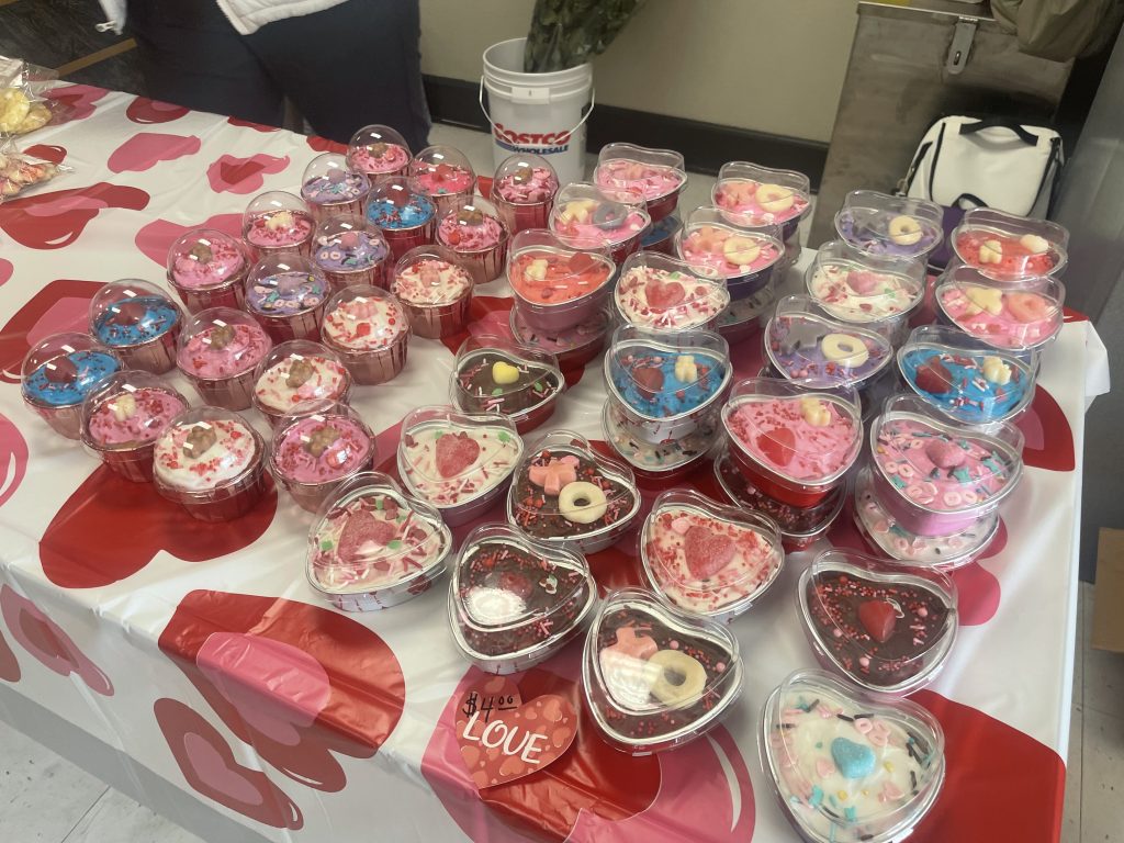 heart shaped baked treats in container on table