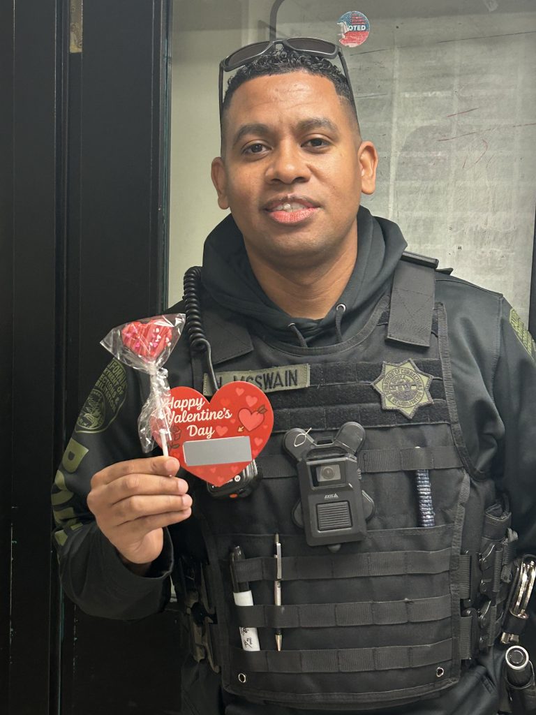 STAFF MEMBER HOLDING VALENTIINES GRAM