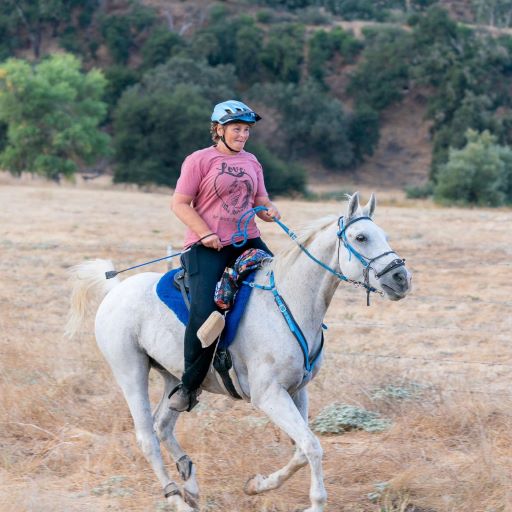 Photo of CDCR educator Vera Valdivia-Abdallah Builds riding her horse in an endurance competition