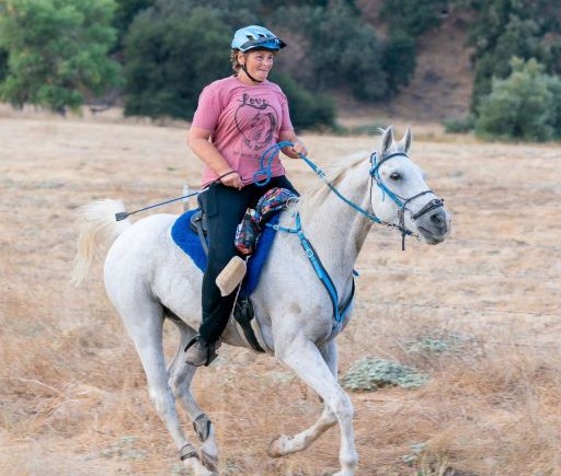 Riding a horse at Rancho Huasna is Assistant Principal Vera Valdivia-Abdallah.